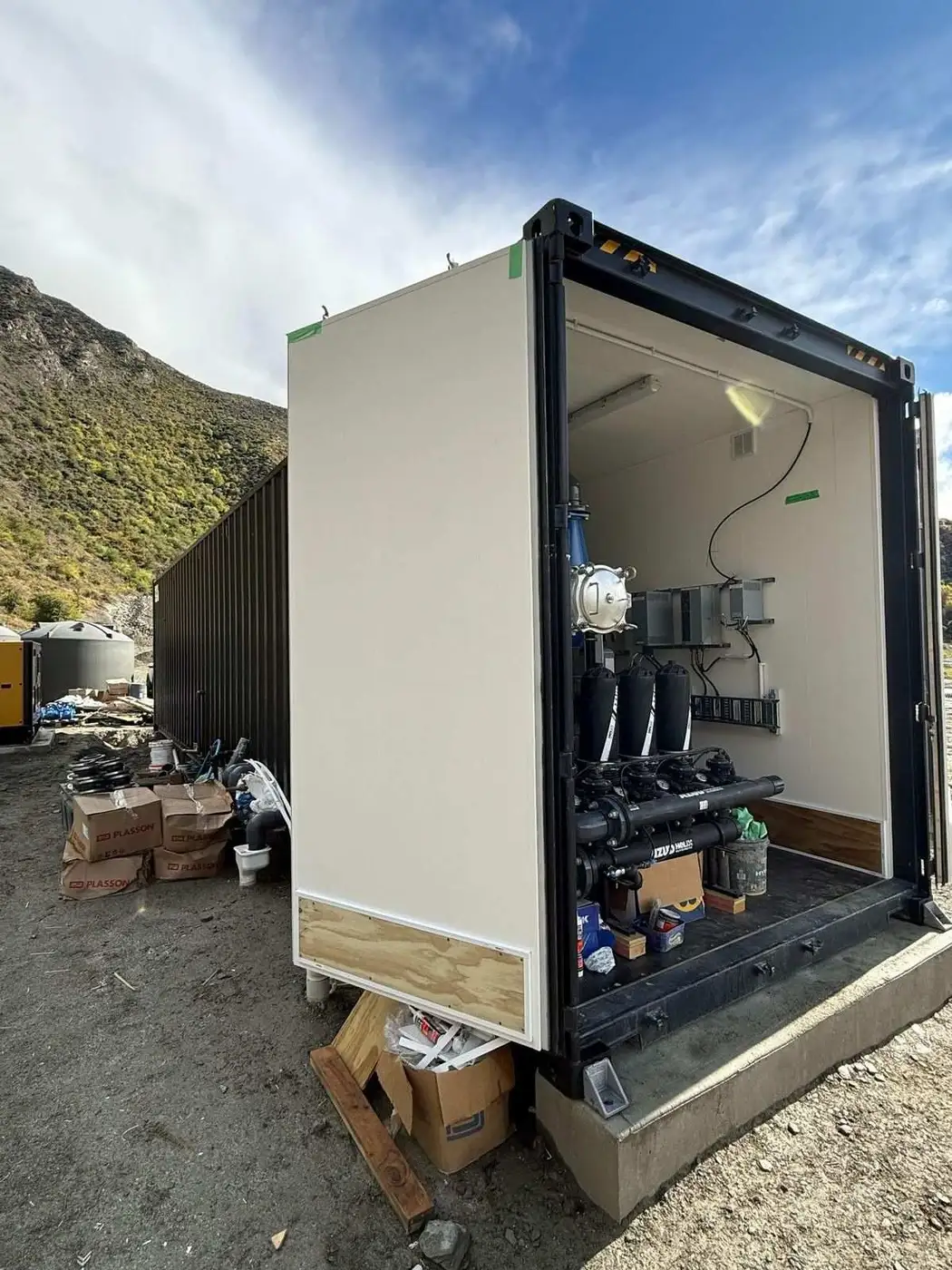 Container plant with open door showing internal pipework, Cardrona Valley